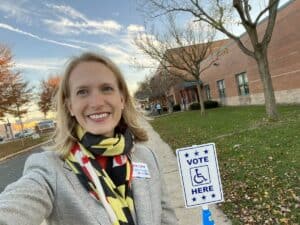 This is a photograph of Brooke Lierman, Maryland's new comptroller, at a Maryland voting booth. 