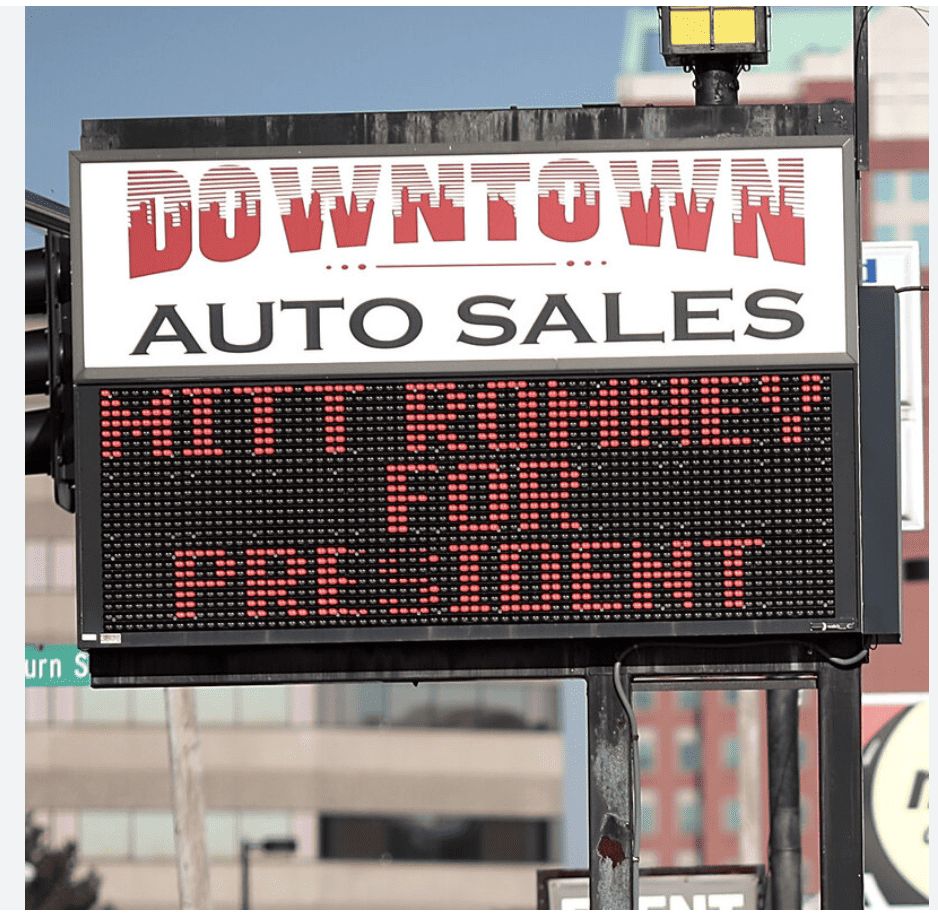 This is a photograph of an American small business displaying a Mitt Romney for President sign. 