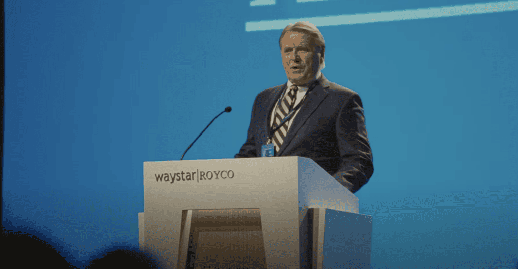 This is a screenshot of Waystar Roycoy's chief financial officer, Karl Muller, speaking at the company's shareholder meeting in season three of the series. 