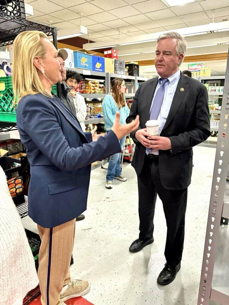 This is a photograph of 6th Congressional District candidate April McClain Delaney chatting with Maryland Congressman David J. Trone. 