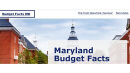 Screenshot of BudgetFactsMD.com, a Maryland Democratic Party website about the state budget. The site features an image of the Maryland State House with bold text reading "Maryland Budget Facts" and navigation links to pages titled "The Truth About the 'Surplus'" and "Fact Check."