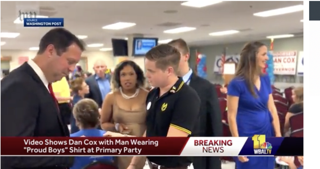 This is a photograph of 2026 Maryland Gubernatorial candidate Dan Cox accepting a gift from a Proud Boys member in 2022.